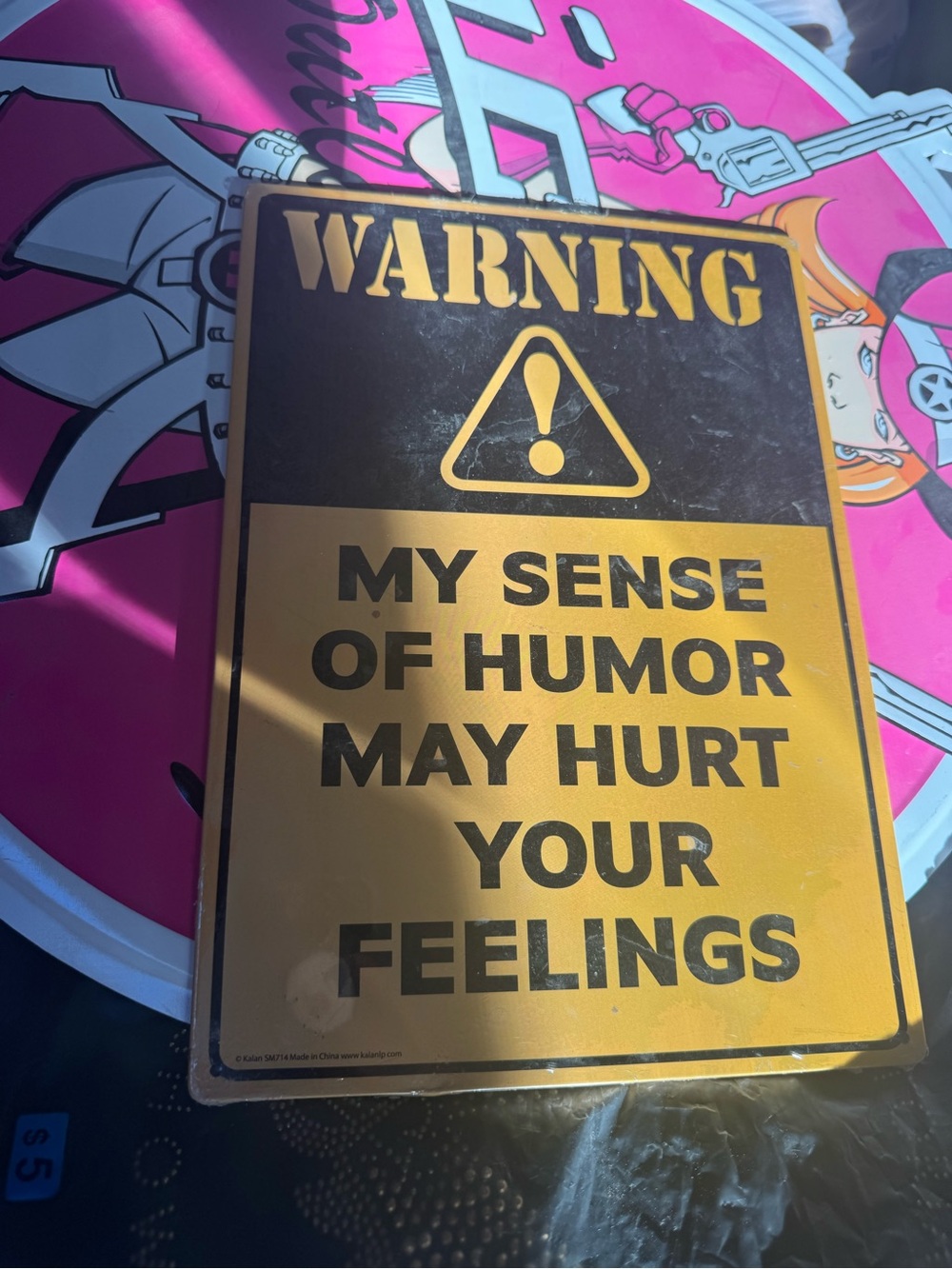 "My Sense of Humor May Hurt Your Feelings" metal sign with black/yellow warning